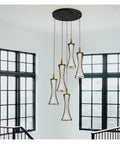 Modern Black Creative Pendant Lamp Pretty Waist LED Light for Duplex Living Room Staircase Loft Restaurant (Colour: 1Light Size: Neutrallight4000K) (5lights Neutrallight4000K) hanging above a staircase.