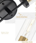 Close-up of Black Wall Sconce Lighting Modern Vanity Fixture With Clear Glass Shades Dimmable Over Mirror Bath Lights, metal base detail.