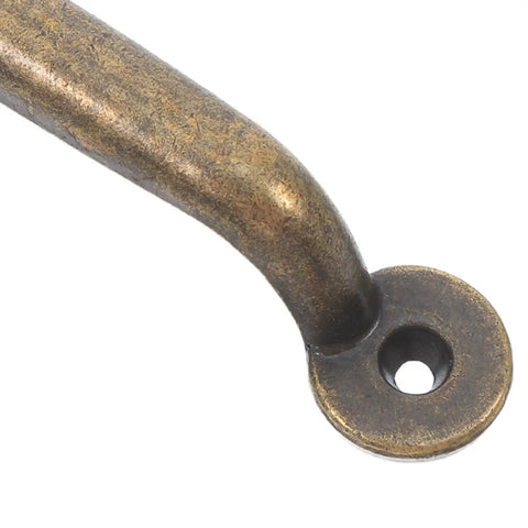 Close-up of a rustic bronze cabinet drawer pull in vintage iron for modern home furniture, showing smooth finish and durable construction.