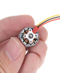 Kickass Mini RC Quadcopter Motor For DIY FPV Drones 1104 Brushless Micro Motor 1 2S 4300KV held by fingers close-up view