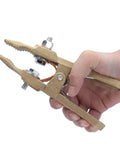Heavy Duty Brass Welding Ground Clamp For Stick Mig Tigs And Cutting Tasks With Secure Locking Set Screws For Solid Earth Wire Connection In Professional Shop Settings, held in hand.