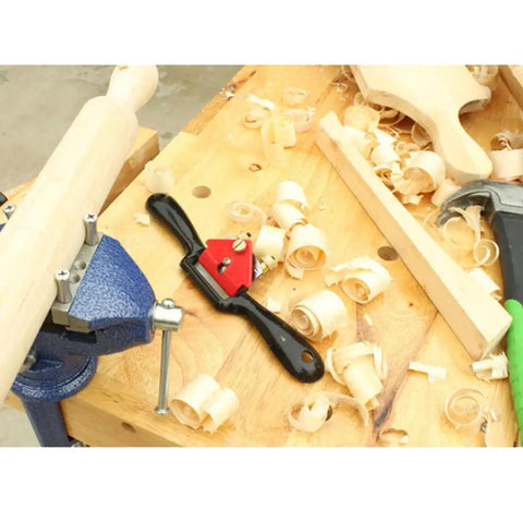 10 Inch Adjustable SpokeShave with Flat Base For Woodworking on woodwork table with shavings and tools