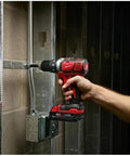 Badass M18 Compact 1/2 Inch Drill Driver With 500 Inch Pounds Of Torque being used on metal framing in a construction environment.