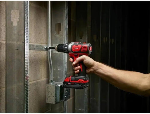 Badass M18 Compact 1/2 Inch Drill Driver With 500 Inch Pounds Of Torque being used on metal framing in a construction environment.