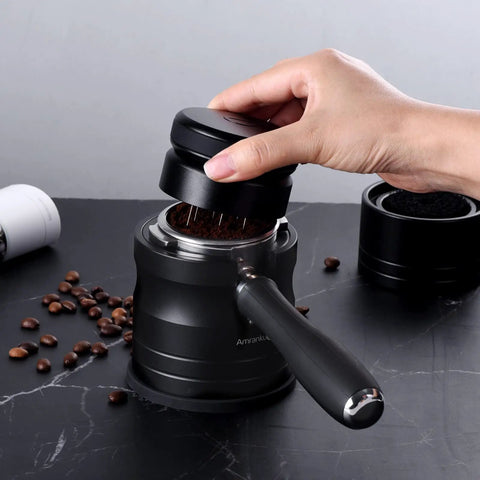 Hand using 54mm Espresso Portafilter Holder And Tamper Stand With Non Slip Base For Aluminum Alloy 54mm Espresso Machines Black