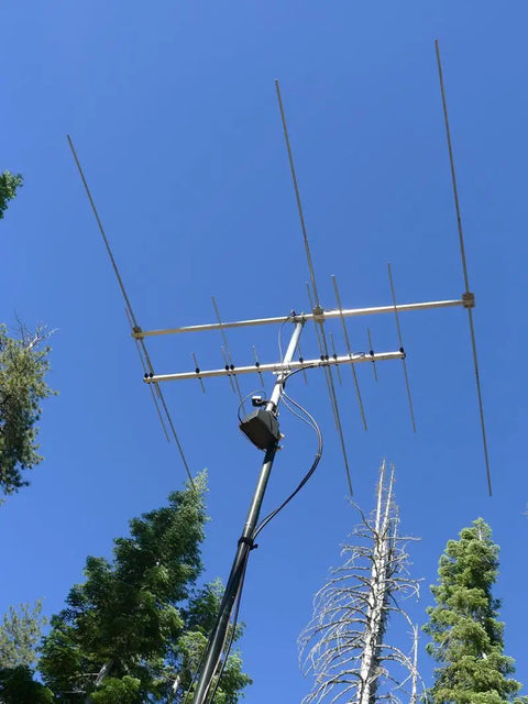 TV antenna on a mast in forest, for use with Beefy Portable WiFi Rotator Controller With Compass For TV Antennas PWRC Battery Powered 12VDC