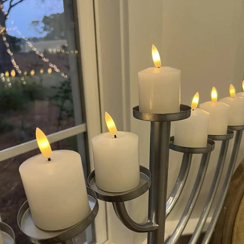 Display of six pack flameless pillar candles with 3D flame, battery-operated real wax LED votive candles, safe home decor