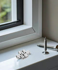 Tiny 43mm Zinc Alloy Concealed Door Hinges 4 Pack For Jewelry Boxes And Small Cabinets, Hidden Cross Folding Hardware placed on a windowsill