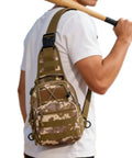 Man wearing Waterproof Tactical Crossbody Backpack With MOLLE System, military camouflage, side view, outdoors