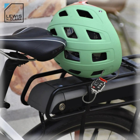 Triple Security TSA Luggage Locks Set secures bike helmet to bike with black lock in urban setting.