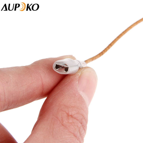 Close-up of Aupoko thermocouple heater connector on beige insulated wire; silver cylindrical tip with flat terminals.