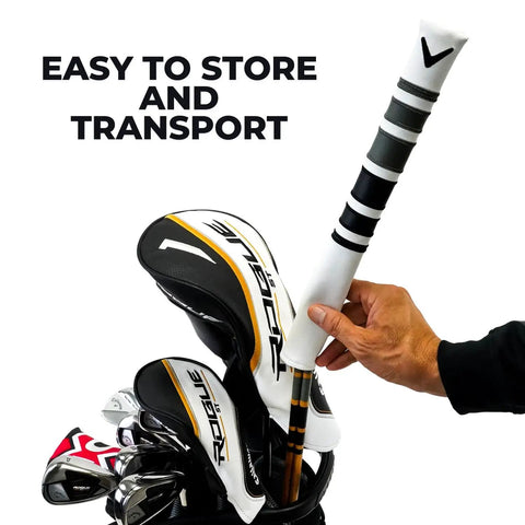 Hand placing Heritage Wood Golf Alignment Sticks With Cover in a golf bag, showcasing portable design and vintage hickory style.
