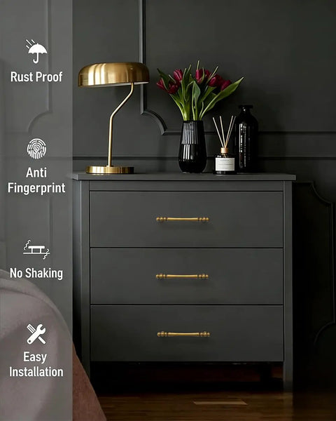 10 Pack 3 Inch Antique Brass Cabinet Pulls on dark dresser with lamp and vase, showing rust-proof, anti-fingerprint features.