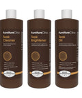 Total Patio Game Changer Teak Care Kit For Outdoor Furniture That Knocks Out Grime While Cleaning Brightening Treated Wood With Cleaner Brightener Oil Set For A Crisp Fresh Backyard Vibe displaying three bottles of teak cleaner, brightener, and oil.