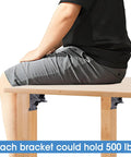 Person sitting on table showing 4 Pack Beefy Heavy Duty Locking Hinge Brackets For Folding Tables, 90 Degree Self Locking Hinges For Table Legs.