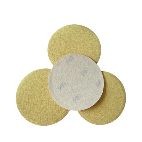 Rock Solid 5 Inch Yellow Dry And Wet Sanding Discs With 80 Grit for Heavy Duty wood metal surface prep laid flat.
