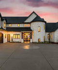 Real Deal Wet Look High Gloss Concrete And Paver Sealer For Exterior Patios featuring five gallon container outside a modern home.