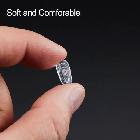 No Sweat Silicone Eyeglasses Nose Pads With Twenty Anti Slip Replacement Pairs Plus A Compact Screwdriver And Backup Screws For A Rock Solid Glasses Repair Kit Giving You Reliable Daily Comfort, clear silicone nose pad held in hand.