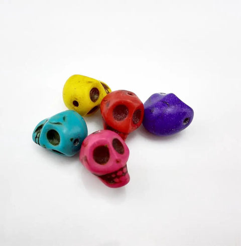 Pack Of 50 Mixed Color Turquoise Skull Head Spacer Beads For DIY Jewelry Making And Crafting, assorted colors, close-up view.