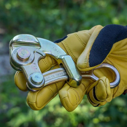 Gloved hand holding Haven's Grip Wire Pulling Tool for Wire Rope Up To 0.25 Inch, showing rugged clamp design