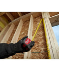 16 Foot Tape Measure With Half Inch Wide Steel Blade In A Rugged ABS Case being used on a wooden construction frame
