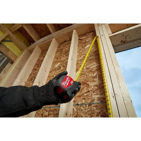 16 Foot Tape Measure With Half Inch Wide Steel Blade In A Rugged ABS Case being used on a wooden construction frame