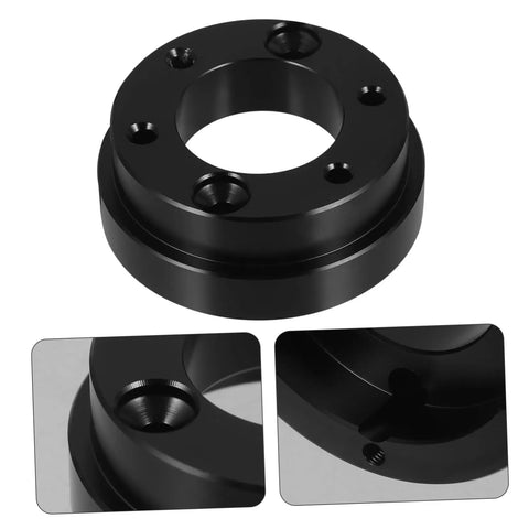 Close-up of Racing Car Steering Wheel Height Adapter Plate Kit showing black metal construction and mounting holes.