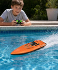 Child playing with Ultra Fast RC Boat With Dual Motors Auto Self Righting Waterproof Electric Speedboat in a pool