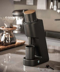 Top Shelf Electric Conical Burr Coffee Grinder Single Dose Fresh Roast Mill With Quick Stepless Dialing For Espresso Pour Over Drip And French Press In Clean White on kitchen counter.