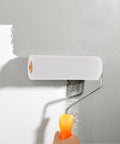 10 Pack High Density Foam Paint Roller Covers Mini Wall Paint Rollers painting a grey wall with smooth finish