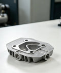Oil-Free Silent Cast Aluminum Air Compressor Cylinder Head Replacement Part With 13 Size Options, gray, top view on table
