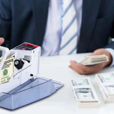 Portable Money Counter Machine Mini Bill Counter For Fast Cash Counting on office desk, man holding bills, gray device