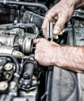 Heavy Duty Folding Socket Wrench Set Featuring Four Precision Cut Openings For Tight Squeezes And Faucet Repair Solid Steel Construction in use on an engine.