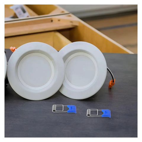 100 Pcs Spring Clips Snap Downlight Mounts For Garage Fixtures LED Strip Light Accessories with recessed lights on table.