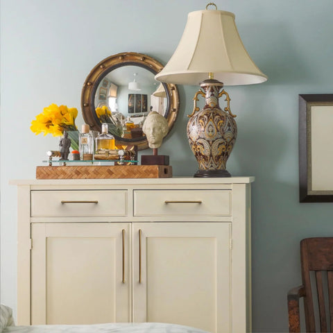 White dresser with 10 Pack 5 Inch Vintage Antique Brass Cabinet Pulls For Kitchen Cabinets And Dressers, ornate lamp, and decorative mirror.