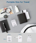 6 In 1 EU Travel Power Plug Adapter With Three Outlets Two USB A Ports And One USB C Port shown with travel essentials