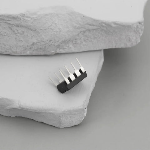 Close-up of ICL7660S CMOS voltage converter IC PDIP8, ideal for low voltage DIY projects, showing pins and compact design