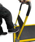Person folding Heavy Duty Foldable Push Cart Dolly With 660 Lb Capacity And Upgraded Collapsible Hand Truck, yellow frame visible