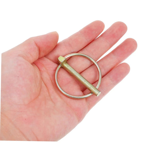 Heavy Duty Lynch Pin Kit With Rings Eight Piece Assortment For Trailers, Trucks And Mowers Galvanized Steel Safety Pins For Secure Attachment And Quick, Reliable Locking In Tough Jobs. single galvanized lynch pin with ring in hand