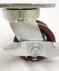 4 Inch Swivel Caster With Burgundy Ductile Steel Wheel And 7/8 Inch V Groove features a locking brake and roller bearings for smooth glide.