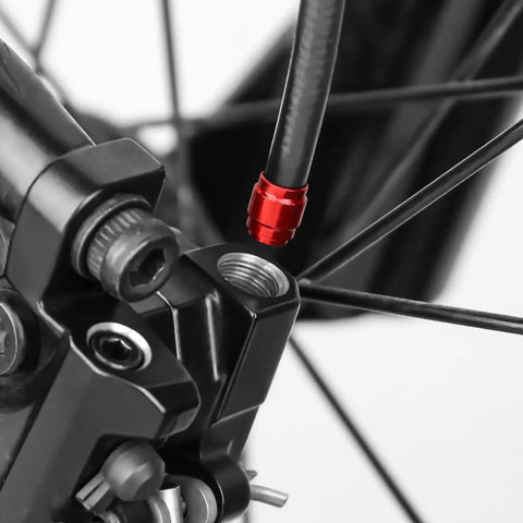 Close-up of Three Meter Hydraulic Brake Hose Kit For Avid SRAM Systems with red connecting insert attached.