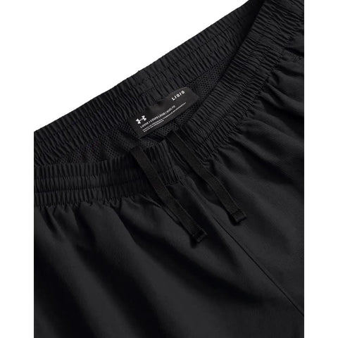Close-up of Mens Woven Vital Workout Pants with Lightweight Ripstop Fabric, black waist detail, regular fit with slim leg.