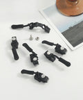 Universal Zipper Repair Kit With Removable Sliders And Quick Fix Heads, showing black adjustable zipper pulls and components on table.