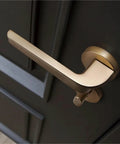 Gold Interior Door Handle Lock For Bedroom Hardware, satin finish privacy lock on grey door, easy install reversible design.