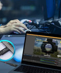 Laptop streaming gaming content with HDMI video capture card setup, close-up of connection in use, showing game on screen.