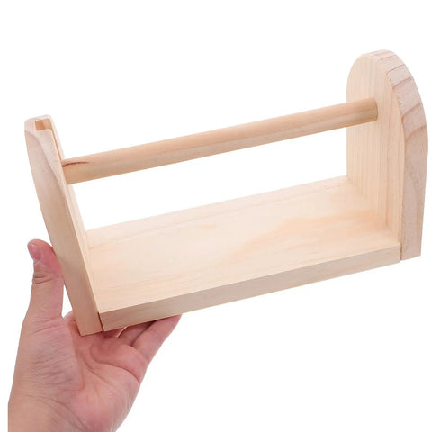 Hand holding solid wood tape dispenser with razor sharp blade for clean desk organization and tidy workspace.