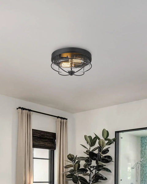 12 Inch 2 Light Farmhouse Flush Mount Ceiling Light With Seeded Glass Shade In Sand Black Finish in a modern living space.