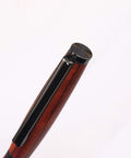Top view of Slimline Pen Kit Gun Metal 10 Pack Ballpoint Twist with Cross Style Refills, showing black and wood finish.