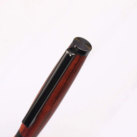 Top view of Slimline Pen Kit Gun Metal 10 Pack Ballpoint Twist with Cross Style Refills, showing black and wood finish.