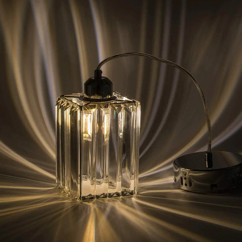 Crystal Cuboid Pendant Lights Set Of 3 In Polished Chrome Dimmable Mini Pendant Fixtures with prismatic shine illuminating a room.